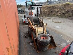 Bobcat 34.3 skid steer loader w/ extra tires and bucket.