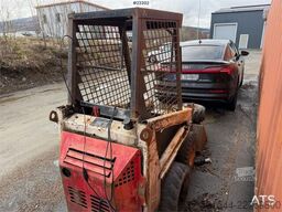 Bobcat 34.3 skid steer loader w/ extra tires and bucket.