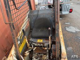 Bobcat 34.3 skid steer loader w/ extra tires and bucket.