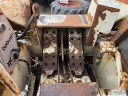 Bobcat 34.3 skid steer loader w/ extra tires and bucket.