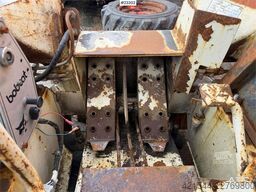 Bobcat 34.3 skid steer loader w/ extra tires and bucket.