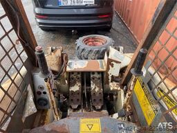 Bobcat 34.3 skid steer loader w/ extra tires and bucket.