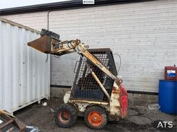 Bobcat 34.3 skid steer loader w/ extra tires and bucket.