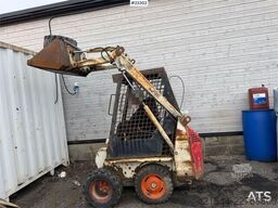 Bobcat 34.3 skid steer loader w/ extra tires and bucket.
