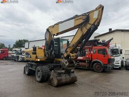 Caterpillar M318D Schnellwechsler Schwenkfunktion OilQuick OQ70 55 Klima Verstellausleger