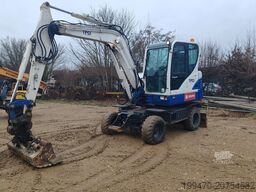 Hyundai R55W-9A with 3 excavator buckets