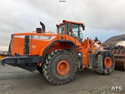 Doosan DL550-5 wheel loader with scale, bucket, and new t