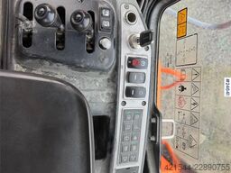 Doosan DL550-5 wheel loader with scale, bucket, and new t