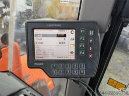 Doosan DL550-5 wheel loader with scale, bucket, and new t