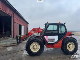 Manitou MLT 633 telehandler with hydraulic pallet forks.