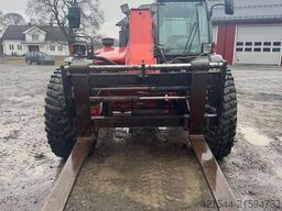 Manitou MLT 633 telehandler with hydraulic pallet forks.