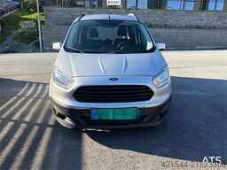 Ford Transit Courier with roof rails, chains, summer/wi