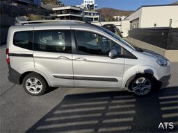 Ford Transit Courier with roof rails, chains, summer/wi