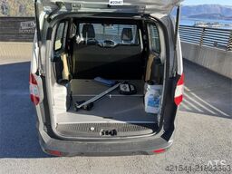 Ford Transit Courier with roof rails, chains, summer/wi