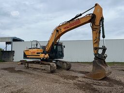 Hyundai HX300 NL with a bucket and ripper