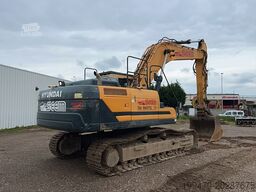 Hyundai HX300 NL with a bucket and ripper