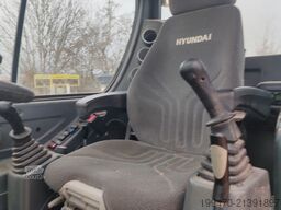 Hyundai R55W-9A with 3 excavator buckets