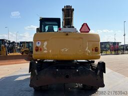 Caterpillar M313D VA - Outriggers + Blade