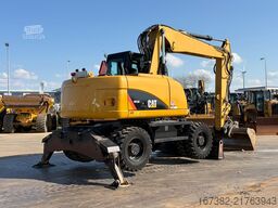 Caterpillar M313D VA - Outriggers + Blade