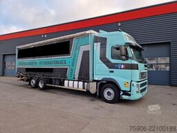 Camion con pianale e telone Volvo FH