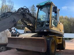 Volvo WE140B wheeled excavator with digging bucket