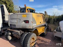 Volvo WE140B wheeled excavator with digging bucket