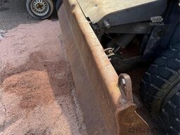 Volvo WE140B wheeled excavator with digging bucket