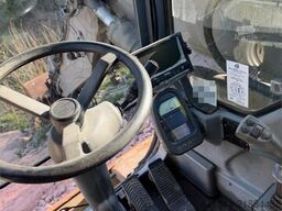 Volvo WE140B wheeled excavator with digging bucket