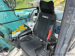 Kobelco Sk140SRLC-3 excavator equipped with a tooth bucket
