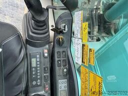 Kobelco Sk140SRLC-3 excavator equipped with a tooth bucket