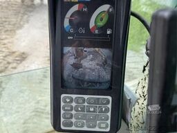 Kobelco Sk140SRLC-3 excavator equipped with a tooth bucket