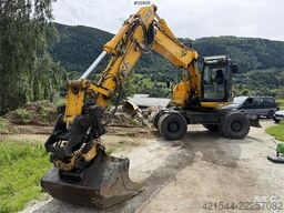 JCB JS145W wheeled machine with a cleaning bucket and