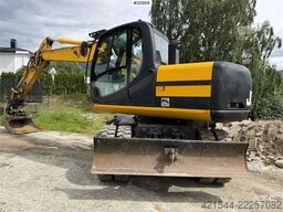 JCB JS145W wheeled machine with a cleaning bucket and