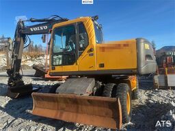 Volvo EW140B wheel digger w/ narrow bucket and rototilt.
