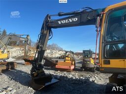 Volvo EW140B wheel digger w/ narrow bucket and rototilt.