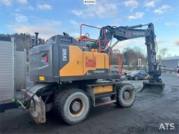 Volvo EW160E wheeled excavator with rototilt and two buc