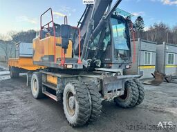 Volvo EW160E wheeled excavator with rototilt and two buc