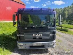 MAN TGL 8.240 4x2 flatbed truck w/ two sets of tires.