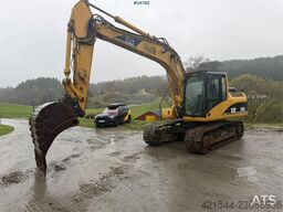 Caterpillar 315C Excavator with digging bucket, hydraulic grad