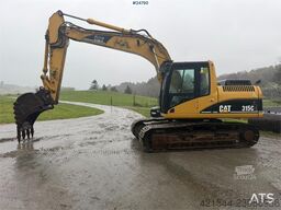 Caterpillar 315C Excavator with digging bucket, hydraulic grad