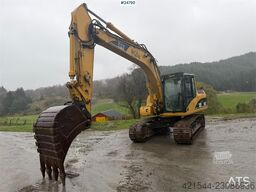 Caterpillar 315C Excavator with digging bucket, hydraulic grad