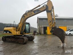 Caterpillar 315C Excavator with digging bucket, hydraulic grad