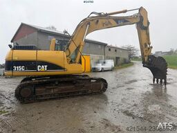 Caterpillar 315C Excavator with digging bucket, hydraulic grad
