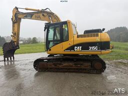 Caterpillar 315C Excavator with digging bucket, hydraulic grad