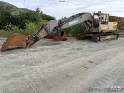 Volvo EC230B excavator with a digging bucket