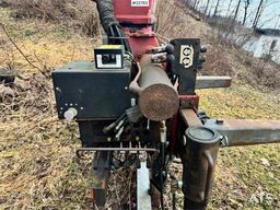 HMF Hermeler Maschinenbau 1150 crane with grab.