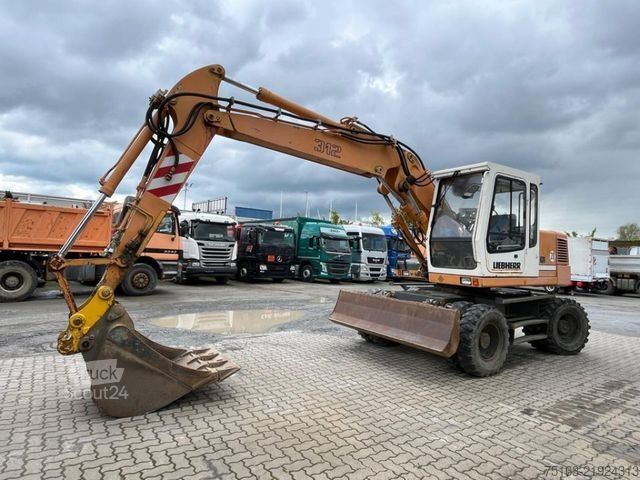 Pyöräalustainen kaivinkone LIEBHERR A 312 Bagger Deutsch Top