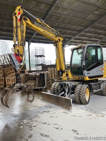 Kolesni bager New Holland MH 2.6