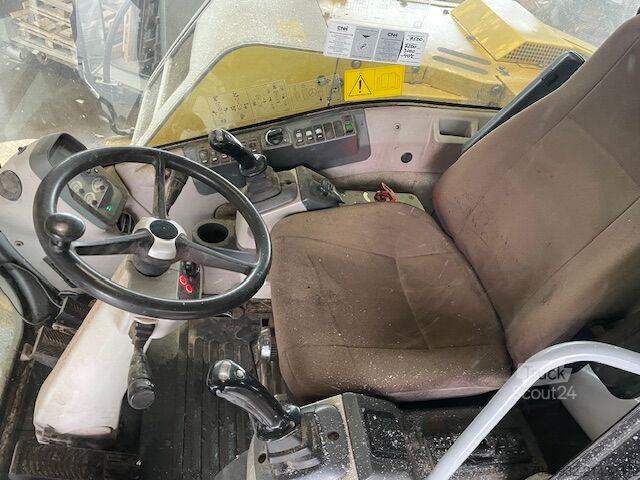 Kolesni bager New Holland MH 2.6