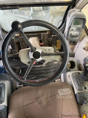 Kolesni bager New Holland MH 2.6